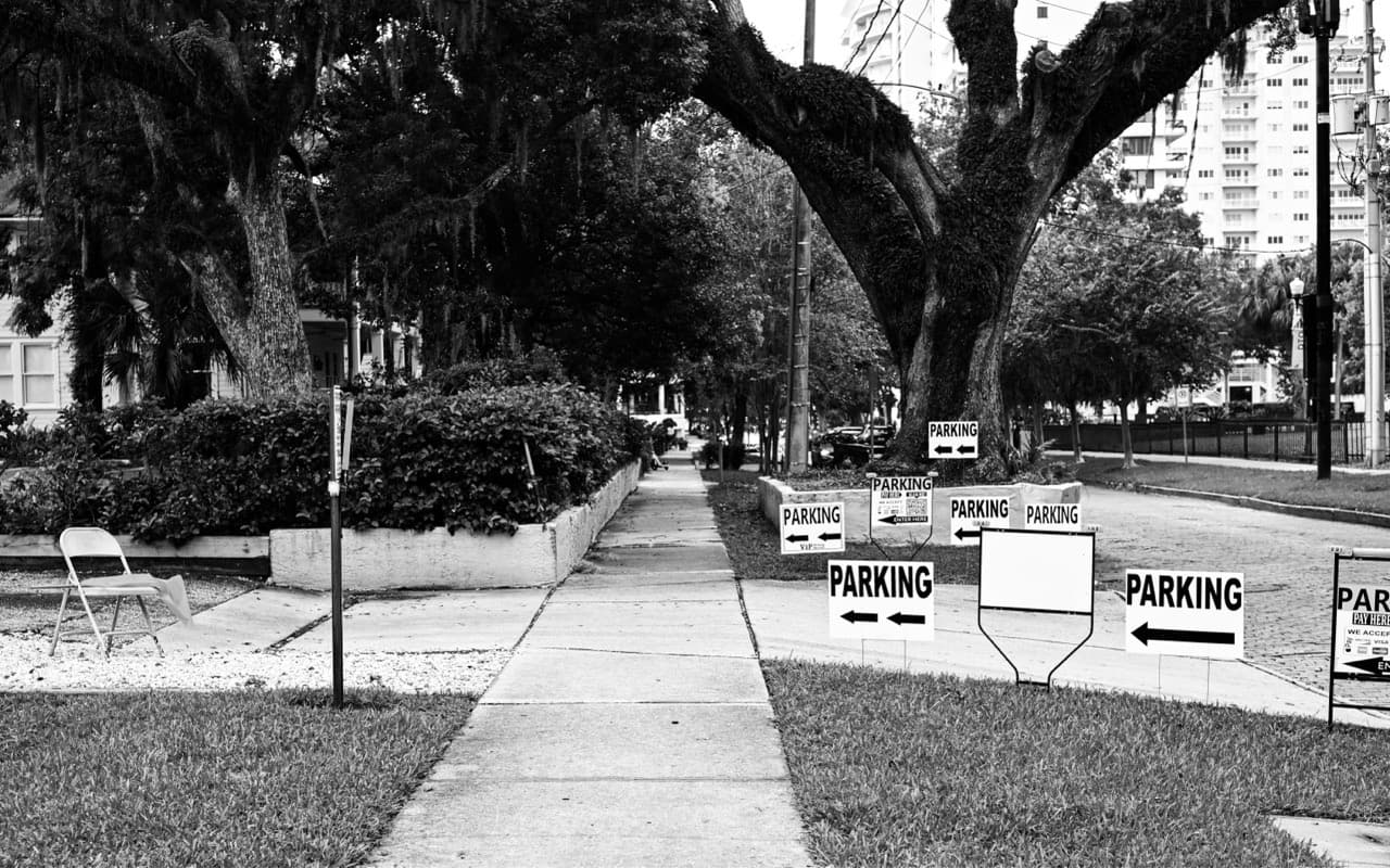 Next to the parking sign - Image